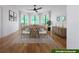 Elegant dining room with hardwood floors, large windows, and rustic table at 776 Old Lathemtown Road, Canton, GA 30115