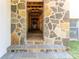 Stone entryway leading to a long hallway under construction at 776 Old Lathemtown Road, Canton, GA 30115