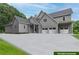 Gray farmhouse with three-car garage and large driveway at 776 Old Lathemtown Road, Canton, GA 30115