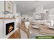 Modern kitchen with island, white cabinetry, and fireplace at 776 Old Lathemtown Road, Canton, GA 30115