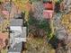 Aerial view of the backyard with trees, a patio, and a detached structure at 7865 Nesbit Ferry Rd, Sandy Springs, GA 30350