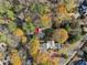 High angle view of the entire property, surrounded by trees and another property at 7865 Nesbit Ferry Rd, Sandy Springs, GA 30350
