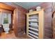 Bathroom with wooden cabinetry, shelves, and hardwood flooring at 7865 Nesbit Ferry Rd, Sandy Springs, GA 30350