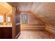 Rustic bathroom with wood paneling, a window, and a single vanity at 7865 Nesbit Ferry Rd, Sandy Springs, GA 30350