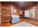 Rustic bathroom with wood paneling, a vintage sink, and a unique window at 7865 Nesbit Ferry Rd, Sandy Springs, GA 30350