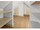 Bedroom closet with built-in shelving at 7865 Nesbit Ferry Rd, Sandy Springs, GA 30350