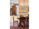 Dining area with exposed brick, chandelier, and wooden table at 7865 Nesbit Ferry Rd, Sandy Springs, GA 30350