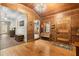 Inviting entryway with wood floors, wood-paneled walls, and a charming chandelier at 7865 Nesbit Ferry Rd, Sandy Springs, GA 30350