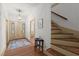 Welcoming entryway with stained glass door, staircase, and hardwood floors at 7865 Nesbit Ferry Rd, Sandy Springs, GA 30350