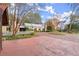 View of the home's exterior from the paved driveway at 7865 Nesbit Ferry Rd, Sandy Springs, GA 30350