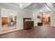 Charming foyer with brick floors, antique furniture, and views into adjacent rooms at 7865 Nesbit Ferry Rd, Sandy Springs, GA 30350