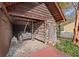 Covered area with a vintage wagon and a log cabin structure at 7865 Nesbit Ferry Rd, Sandy Springs, GA 30350