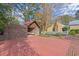 Wooden garage and outbuilding on a paved area at 7865 Nesbit Ferry Rd, Sandy Springs, GA 30350