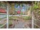 Charming garden with stone walls, various plants, and a white picket fence at 7865 Nesbit Ferry Rd, Sandy Springs, GA 30350