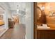 Hallway with brick flooring and view of half-bathroom at 7865 Nesbit Ferry Rd, Sandy Springs, GA 30350