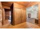 Hallway with wood floors, double doors, and views into adjacent rooms at 7865 Nesbit Ferry Rd, Sandy Springs, GA 30350