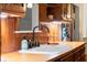 Kitchen sink with farmhouse faucet and wood countertops at 7865 Nesbit Ferry Rd, Sandy Springs, GA 30350