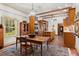 Spacious kitchen with wood cabinets, large windows, and exposed beams at 7865 Nesbit Ferry Rd, Sandy Springs, GA 30350