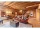 Inviting living room with exposed beams, hardwood floors, and comfortable furniture at 7865 Nesbit Ferry Rd, Sandy Springs, GA 30350