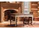 Cozy living room fireplace with rocking chairs and hardwood flooring at 7865 Nesbit Ferry Rd, Sandy Springs, GA 30350
