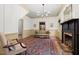 Inviting living room featuring a fireplace, hardwood floors, and classic style at 7865 Nesbit Ferry Rd, Sandy Springs, GA 30350