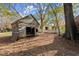 Rustic wooden shed in a backyard setting at 7865 Nesbit Ferry Rd, Sandy Springs, GA 30350