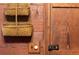 Close-up of a wall showcasing rustic wood paneling, a light switch, and a door latch at 7865 Nesbit Ferry Rd, Sandy Springs, GA 30350