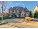 Brick front exterior of a luxurious two-story home with manicured landscaping at 2756 Eudora Trl, Duluth, GA 30097