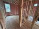 Framed bathroom with insulation, plumbing, and a bathtub at 6120 Hutchins Dr, Buford, GA 30518