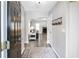 Welcoming foyer entryway with dark wood door, gray walls, and wood-look flooring at 3530 Cobblestone Way, Loganville, GA 30052