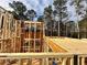 Home framing progress showing the skeletal structure at 10350 Alvin Road, Alpharetta, GA 30022