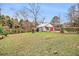 Spacious backyard with detached garage and storage shed at 8451 Duncan St, Douglasville, GA 30134