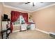 Bedroom/office space with desk, chair, and ceiling fan at 8451 Duncan St, Douglasville, GA 30134