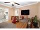 Dining area with hardwood floors, a wooden table, chairs, and a view into the kitchen at 8451 Duncan St, Douglasville, GA 30134