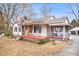 Home with white siding, a stone section, a red porch, and a screened-in area at 8451 Duncan St, Douglasville, GA 30134