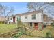 Single-story home with white siding, red doors, and stone accents at 8451 Duncan St, Douglasville, GA 30134