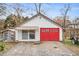 Detached garage with red doors and awning at 8451 Duncan St, Douglasville, GA 30134