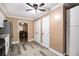 Kitchen with white cabinets, pantry, and view of the dining area at 8451 Duncan St, Douglasville, GA 30134