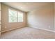 Bright and spacious bedroom with large windows and carpeted flooring at 7640 Homer Dr, Cumming, GA 30028