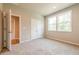 Spacious bedroom with double closet and soft, neutral carpeting at 7640 Homer Dr, Cumming, GA 30028