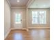 Bright entryway with natural light and hardwood floors at 7640 Homer Dr, Cumming, GA 30028
