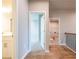 Hallway with laundry area and access to bedroom and bathroom at 7640 Homer Dr, Cumming, GA 30028