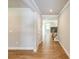 Hallway leading to the living room and staircase at 7640 Homer Dr, Cumming, GA 30028