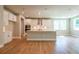 Open kitchen with large island, stainless steel appliances, and plenty of natural light at 7640 Homer Dr, Cumming, GA 30028
