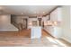 Modern kitchen with white cabinets, island, and hardwood floors at 7640 Homer Dr, Cumming, GA 30028