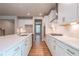 Well-appointed kitchen with stainless steel appliances, white cabinets, and a center island at 7640 Homer Dr, Cumming, GA 30028