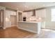 Spacious kitchen with large island, ample counter space, and stainless steel appliances at 7640 Homer Dr, Cumming, GA 30028