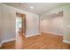 Open-concept living room with access to the kitchen at 7640 Homer Dr, Cumming, GA 30028