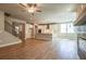 Open plan living room with kitchen and staircase at 7640 Homer Dr, Cumming, GA 30028