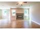 Living room featuring fireplace and large windows at 7640 Homer Dr, Cumming, GA 30028